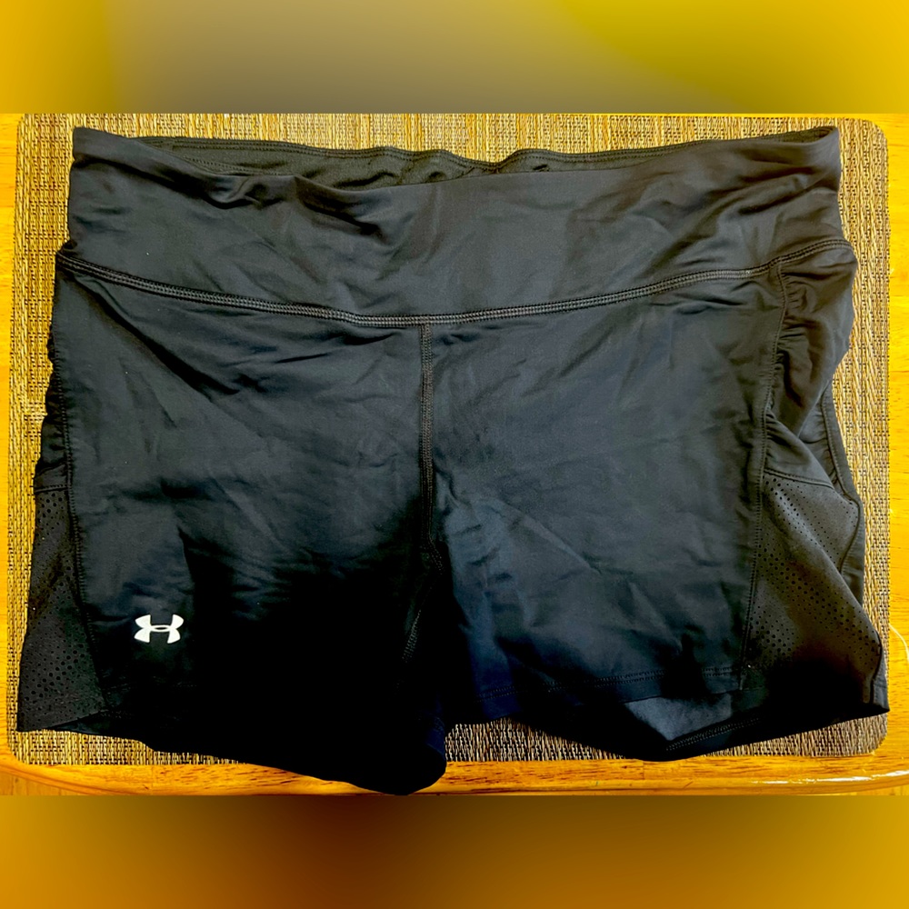 Under Armor heat gear shorts color black size tag missing but it is a large